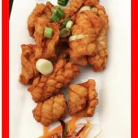 Crispy Calamari · Fresh calamari in our special batter deep-fried served with sweet chili sauce.