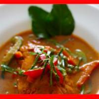 Panang Salmon  · Braised Salmon top with Panang sauce, served with Bell pepper, Peas, Carrot and Kaffir lime ...