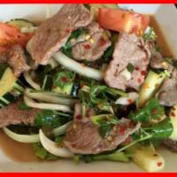 Beef Salad · Slices grilled steak, Tomato, Cucumber, Romaine lettuce, Onion, and Roasted rice powder burs...