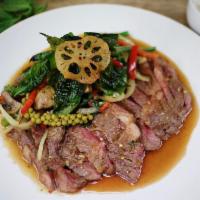 Rib Eye Crispy Basil · 8 oz. Ribeye steak wok-stir fried with fresh Thai Basil, green beans, onions, mushrooms, bel...