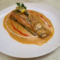 Salmon Panang · Salmon steak grilled and panang curry paste, Coconut milk, Bell Peppers and kaffir lime leaves