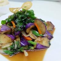 Spicy Mint Eggplant · Stir-fried eggplant with bell peppers, garlic, chili, and fresh basil.