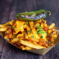 Chilli Cheese Fries · Hand-cut Fries, Chili con Carne with Beans, Cheddar Cheese Sauce, Grilled Jalapeño