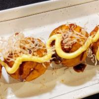 Takoyaki · Octopus balls 5 pieces topped with mayo, takoyaki sauce, mayo, and bonito flakes.