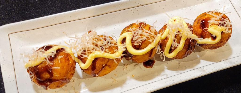 Takoyaki · Octopus balls 5 pieces topped with mayo, takoyaki sauce, mayo, and bonito flakes.