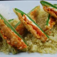 Jalapeno Poppers · Fried jalapenos stuffed with cream cheese and spicy salmon. Topped with spicy mayo and sweet...