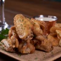 Chicken Wings · 8 Twice cooked chicken wings finished with 1 of our 4 sauces.  Garlic Parmesan, honey bourbo...