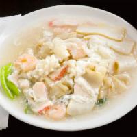 93. Seafood Chow Fun with Egg Sauce · Flat rice noodle.