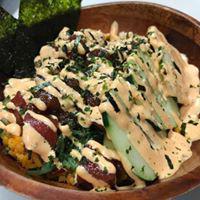 Poke Bowl · Marinated ahi tuna, seaweed salad, rice, cucumbers topped with spicy mayo and furikake.