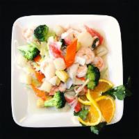 Seafood Delight · Fresh scallops, crab meat and shrimp served with vegetables in our delicious white sauce.