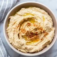 Hummus · Puree of chickpeas mixed with sesame tahini, spices and extra virgin olive oil.