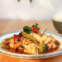 Sea Food Pad Chaa · Shrimps and Calamari, young green peppercorn, long hot chili, baby corn and basil, special s...