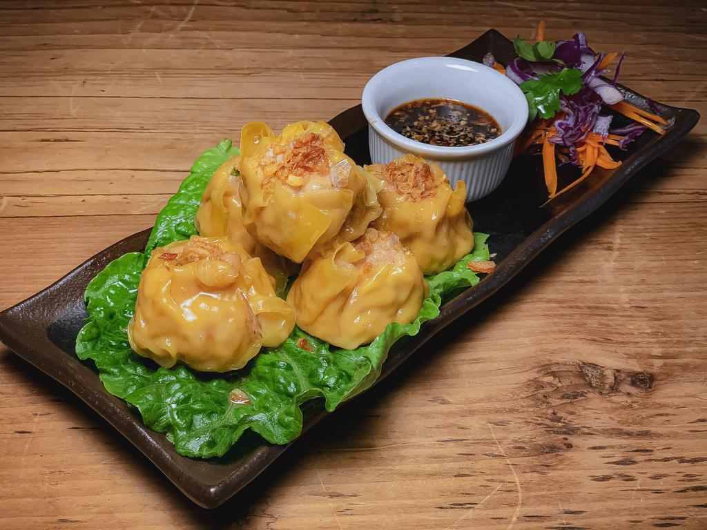 Shrimp Dumpling · Steamed shrimp and chicken dumpling. Water chestnut, sesame oil, scallion, garlic, and ginger soy dip.