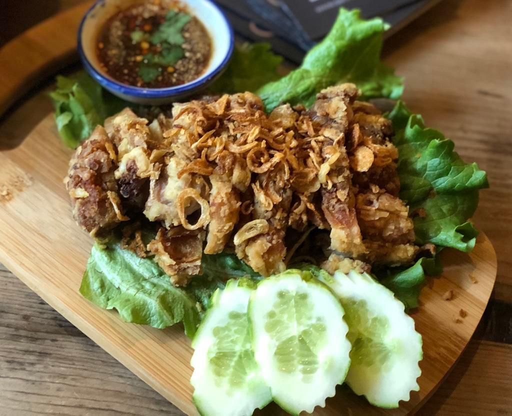What Da Chic · Thai style fried chicken top with crispy shallot, spicy Thai BBQ sauce on the side served with sticky rice