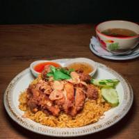 Crispy Chicken Over Rice · Thai style fried chicken topped with crispy shallot served with yellow rice and sweet chili ...