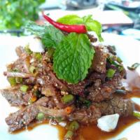 Beef Salad (Gluten-free) · Beef salad north eastern Thai-style. Grilled marinated beef, mint, shallot, toasted rice, re...