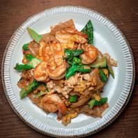 Pad See Ew  · Stir-fried noodles  and yellow bean soy sauce. rice noodles, Chinese broccoli, egg and yello...