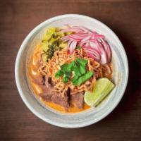 Kao Soi  · Northern Thai-style beef turmeric curry noodles. egg noodles, shallot, pickled mustard green...