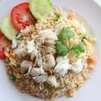 Crab fried rice · Jumbo lump crab meat, scallion, onion, tomato, egg, light soy sauce.
