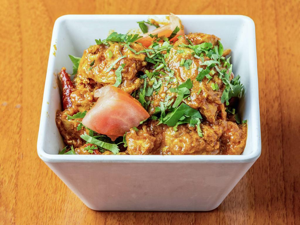 Chicken Curry · Traditional chicken curry prepared with special spices.