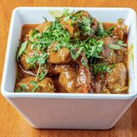 Lamb Curry · Boneless lamb cooked in traditional way in select handcrafted spices. Served with basmati ri...