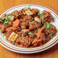 Chicken Manchurian · Battered chicken florets, fried and cooked in sweet and sour sauce with onions and tomatoes....