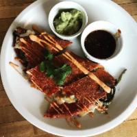 Quesadilla Gringa · Flour tortilla, Oaxacan cheese served with a side of guacamole and salsas. Choice of: plain ...