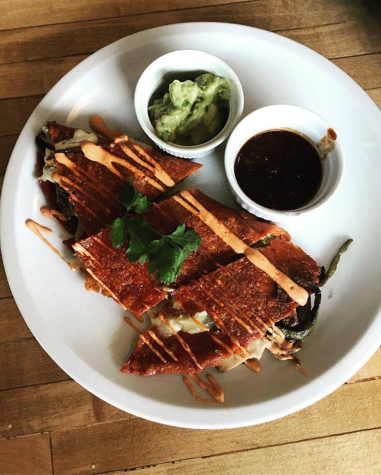 Quesadilla Gringa · Flour tortilla, Oaxacan cheese served with a side of guacamole and salsas. Choice of: plain cheese, chicken tomatillo tinga, carnitas, roasted zucchini and caramelized onion.
