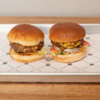 Duo Burger · 2 burgers. Includes Roma tomato, leaf lettuce, shaved onions, pickles, American cheese and h...