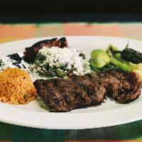 Carne Asada · Served with Mexican chorizo, cactus salad, beans, rice, green onions and jalapeno pepper.