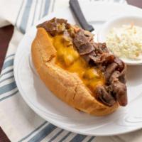Frank Rizzo Philly Style Cheesesteak Sandwich · Roast beef, mushrooms, peppers and onions simmered in beef broth smothered with cheddar or S...