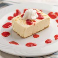 New York Cheesecake · Served with strawberry sauce.