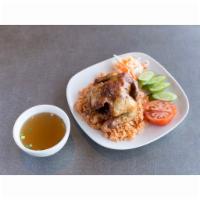 Com Ga Xoi Mo · Tomato rice with cornish hen.