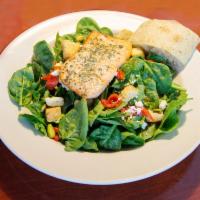 Spinach Salad with Salmon · Our signature spinach salad with wood roasted salmon.