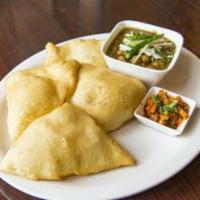 Cholle Bhature · Chick peas served with deep fried flour puri.