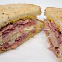 Reuben Sandwich · Corned beef, Swiss and sourkraut on toasted rye with choice of mustard or Thousand Island dr...