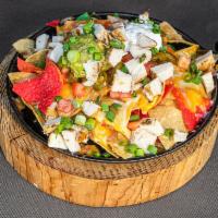 Jackpot Nachos · Joe's favorites. Piled high with refried beans, Jack and Cheddar cheese, tomatoes, jalapenos...