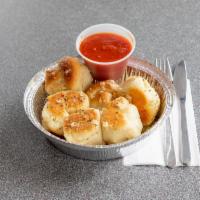 Garlic Knots · Garlic Knots: Rolled baked garlic bread.