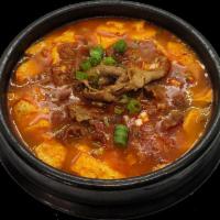 Tofu Stew with Rice · Korean silken tofu in a savory and spicy stew combines with various ingredients. Served with...