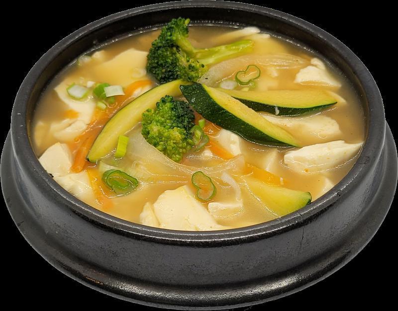 Veggie Tofu Stew · Korean silken tofu in a savory and spicy stew combines with vegetables. Served with rice, flat noodle, or ramen.