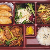 Spicy Pork Bento Box · Grilled and marinated pork bulgogi. Served with rice, fresh seasonal salad, and stir-fried n...