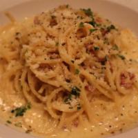 SPAGHETTI CARBONARA ALLA ROMANA · Spaghetti With Eggs, Bacon, And Parmesan Reggiano