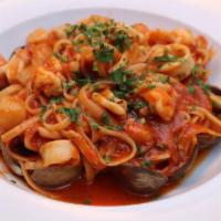 LINGUINI AI FRUTTI DI MARE · Linguini With Clams, Bay Scallops, Calamari, Shrimps, And Spicy Tomato Sauce