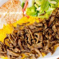 Beef Plate · Authentic lamb recipe on a bed of saffron rice, sides of tzatziki, green salad, and choice o...