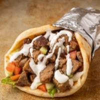 1. Lamb Gyro · Doner style lamb served in hot pita bread. Served with Tomatoes, lettuce onions, green peppe...