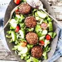 Falafel Over salad · Salad with fried balls made from beans. 