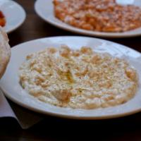 Syrian Humus · Traditional Syrian mezze of whole chickpeas, tahini, olive oil and spices