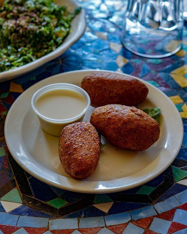 Kibbeh · A ball of ground lamb and burgul wheat stuffed with lamb, onions and almonds and deep fried.