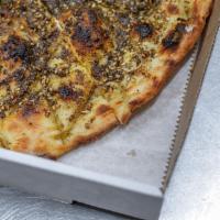 Zaatar Bread · Pita topped with olive oil, sesame and thyme. 