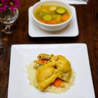 Chicken Couscous · Chicken with rustic stew of potatoes, carrots, zucchini, turnips, sweet potatoes and chickpe...